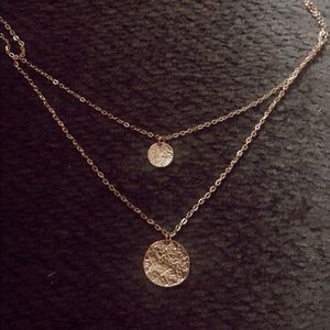 gold colored necklace